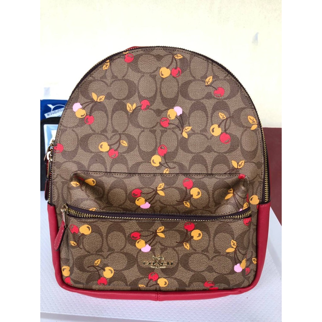 MEDIUM CHARLIE BACKPACK IN SIGNATURE CANVAS WITH CHERRY PRINT Shopee