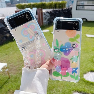 เคสโทรศัพท์มือถืออะคริลิคแข็ง กันกระแทก ลายดอกไม้ ผีเสื้อน่ารัก พร้อมสายคล้องมือ สําหรับ Samsung Galaxy Z Flip 4 Z Flip3