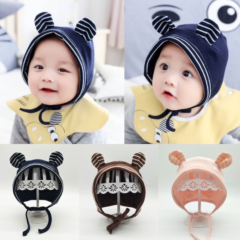 ภาพหน้าปกสินค้าหมวกเด็กเด็ก หมวกเด็กแรกเกิด - 12 เดือน แบบผูกคาง แต่งหูหมีเล็กๆ ลายทาง ผ้าคอตตอนนิ่มใส่แล้วน่ารัก