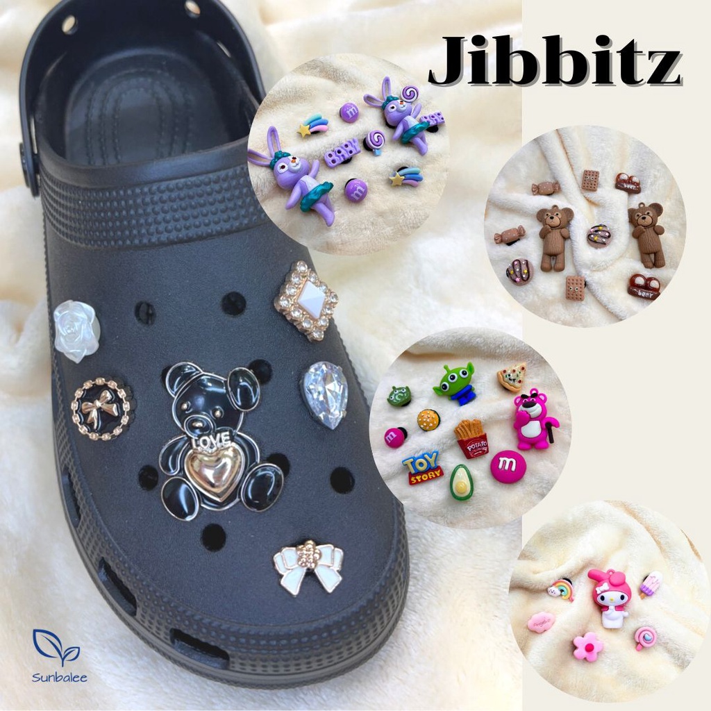 ภาพหน้าปกสินค้าJibbitz อุปกรณ์เสริมหัวเข็มขัดพีวีซีสําหรับรองเท้า Shoe Charms DIY ตัวติดรองเท้า เซ็ทตัวติดรองเท้า SUNBALEE จากร้าน sunbalee บน Shopee