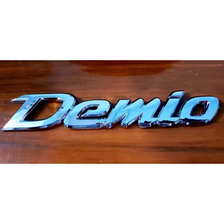โลโก้ Demio ติดท้ายรถ สำหรับ Mazda 2 SkyActiv และ Mazda 2 โฉมเก่า ( Logo demio เดมิโอ้ Mazda2 )