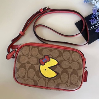 กระเป๋า COACH CROSSBODY POUCH IN SIGNATURE CANVAS WITH MS. PAC-MAN COACH F73446