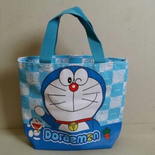 กระเป๋าถือ (หนัง PU) มีซิป มีผ้าซับใน ลาย โดราเอม่อน Doraemon ขนาด 11x9x3.5 นิ้ว