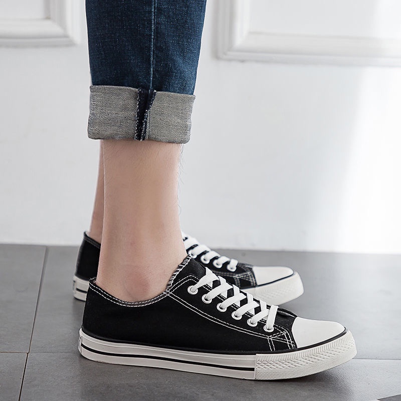 ภาพหน้าปกสินค้าScorpio รองเท้าผ้าใบส้นแบนแฟชั่นบุรุษและสตรี รองเท้าผ้าใบสีขาวรองเท้านักเรียน พื้นนิ่ม ระบายอากาศดี