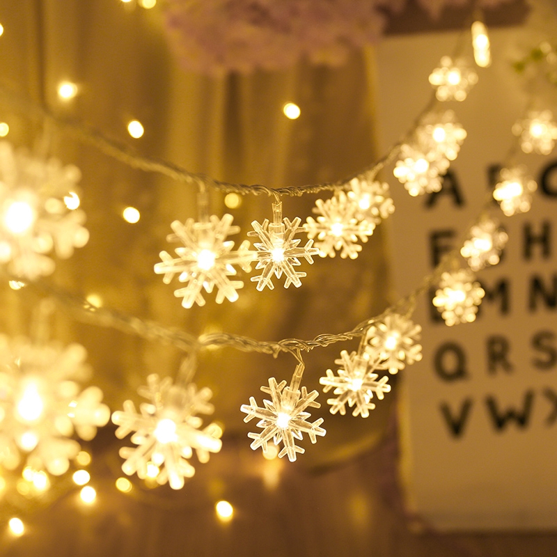 ภาพหน้าปกสินค้าสายไฟ รูปเกล็ดหิมะ LED 20 ดวง สำหรับตกแต่งต้นคริสต์มาส
