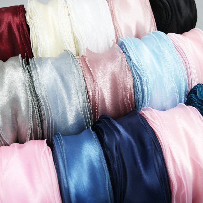 ภาพหน้าปกสินค้าริบบิ้นผ้าออร์แกนซ่า ขนาด 55 มม. (5 หรือ 25 หลา/ม้วน) จากร้าน ribbonhouse001.th บน Shopee