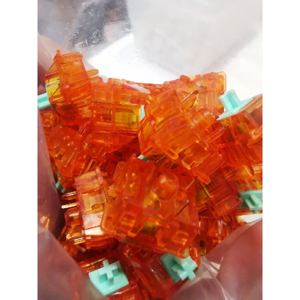 ภาพหน้าปกสินค้าสีส้มเขียวสำหรับmechanical keyboard จากร้าน click_collect.2021 บน Shopee