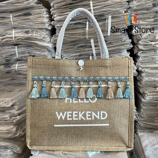 ภาพขนาดย่อของภาพหน้าปกสินค้ากระเป๋าผ้ากระสอบผ้าหน้าใบใหญ่ งานสวย มีพู่ Hello weekend จากร้าน smart_store_th บน Shopee