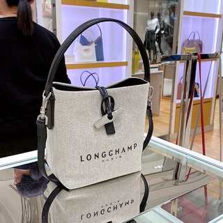 ภาพหน้าปกสินค้ากระเป๋า Longchamp แท้ กระเป๋าทรงถัง ผ้าใบ กระเป๋าถือ handbag shoulder bag crossbody bags ที่เกี่ยวข้อง