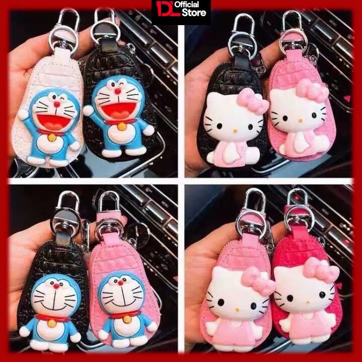 ภาพหน้าปกสินค้ากระเป๋าเก็บกุญแจรถยนต์ กระเป๋าใส่รีโหมดรถยนต์รถมอเตอร์ไซต์ Hello Kitty  Doraemon พวงกุญแจรถยนต์หนังแท้(พวงกุญแจรถยนต์)