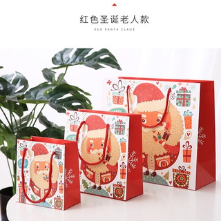 ภาพหน้าปกสินค้า🍑GIFT🍑 ถุงกระดาษ ถุงหูหิ้ว ใส่ของขวัญ ของชำร่วย วันคริสมาสต์ (พร้อมส่ง) ที่เกี่ยวข้อง