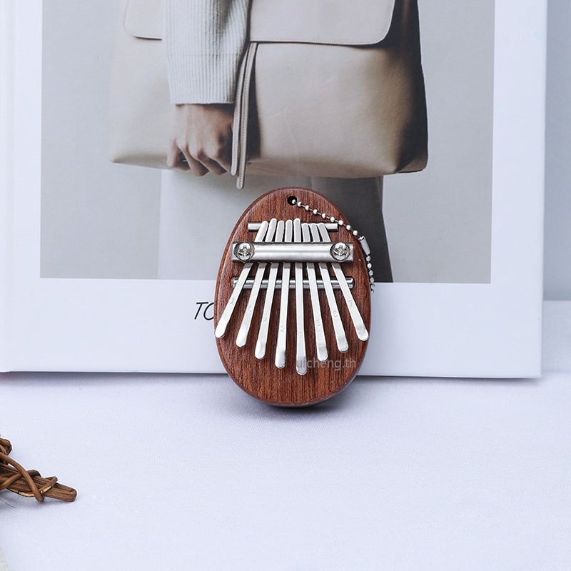ภาพหน้าปกสินค้าคาลิมบา 8 คีย์ เเบบพวงกุญเเจ 8 Key Mini Kalimba exquisite Finger Thumb Piano Marimba Musical good accessory Pendant Gift
