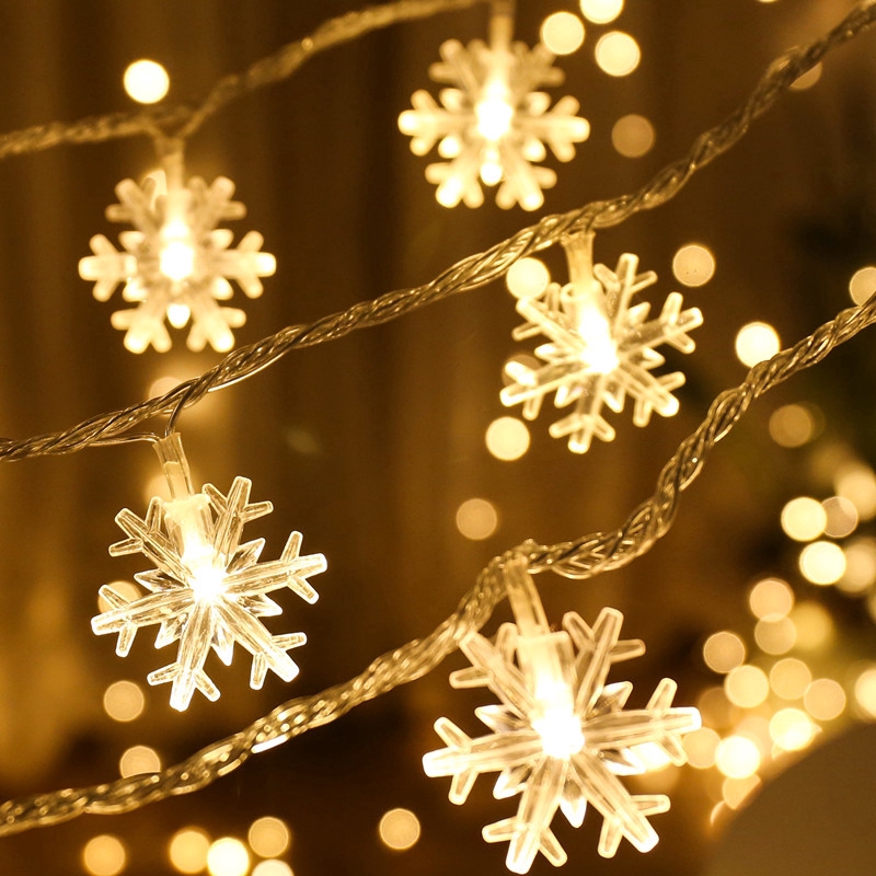 ภาพหน้าปกสินค้าสายไฟ รูปเกล็ดหิมะ LED 20 ดวง สำหรับตกแต่งต้นคริสต์มาส จากร้าน amazinglife.th บน Shopee