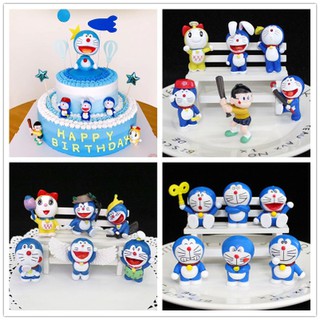 ภาพหน้าปกสินค้าตุ๊กตาโดราเอมอน Birtday สําหรับตกแต่งเค้ก ที่เกี่ยวข้อง