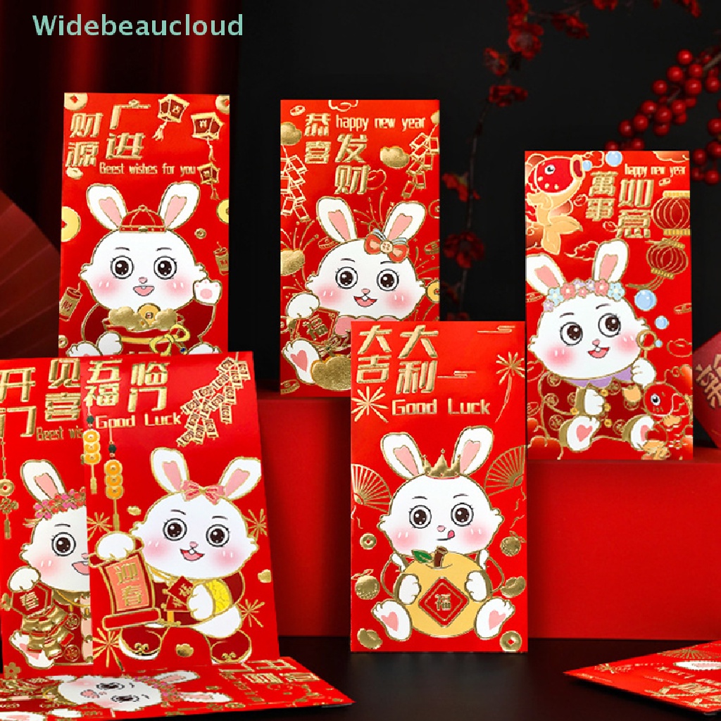 ภาพหน้าปกสินค้าWidebeaucloud กระเป๋าซองจดหมาย ลายการ์ตูนกระต่าย สีแดง เหมาะกับเทศกาลปีใหม่ สําหรับเด็ก 2023 6 ชิ้น จากร้าน widebeaucloud.th บน Shopee