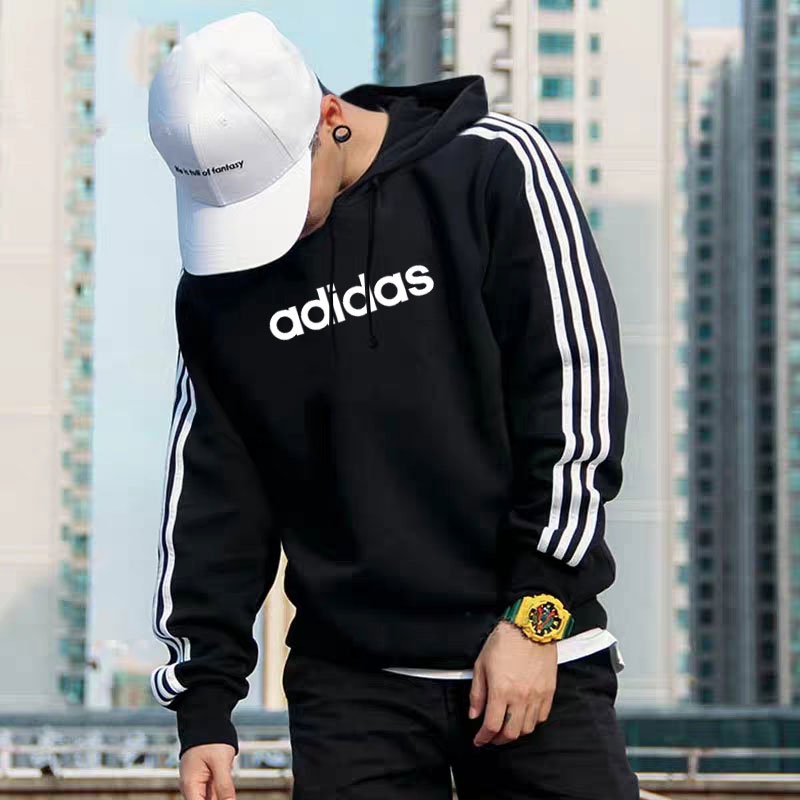 ภาพหน้าปกสินค้าAdidas เสื้อกันหนาว แขนยาว มีฮู้ด พิมพ์ลาย ทรงหลวม ลําลอง แฟชั่นเรียบง่าย สําหรับผู้ชาย ผู้หญิง จากร้าน yibei.th บน Shopee