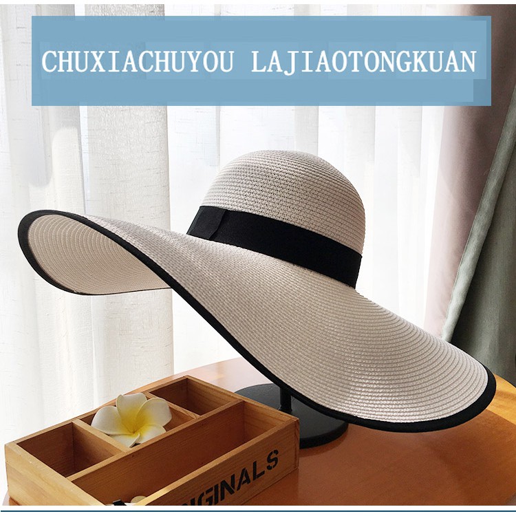 ภาพหน้าปกสินค้าหมวกสานปีกกว้าง ฟีลธรรมชาติ หมวกชายทะเล กันแดด สไตล์มินิมอล พร้อมส่งในไทย