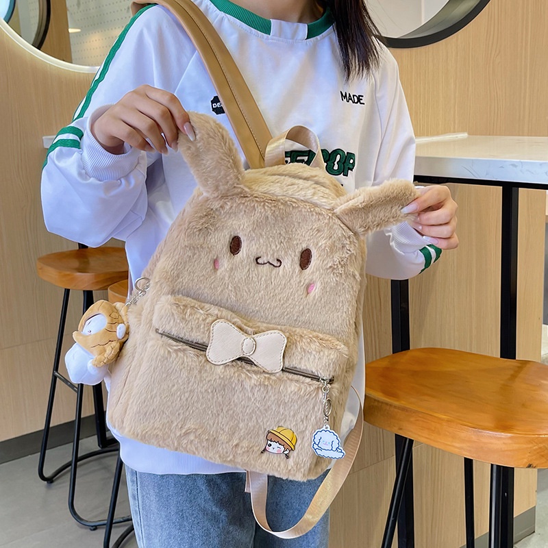 ภาพหน้าปกสินค้าใหม่ กระเป๋าเป้สะพายหลัง กระเป๋านักเรียน ขนปุย หูตุ๊กตา Sanrio Melody น่ารัก จากร้าน yubangcar3.th บน Shopee