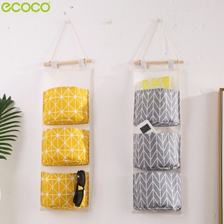 ecoco กระเป๋าผ้าแขวน เก็บของ ถุงแยกสัมภาระ จัดระเบียบจัดเก็บของใช้ส่วนตัว ถุงช่องใส่ของแบบแขวนผนัง มีช่อง 3ช่อง ทนทาน