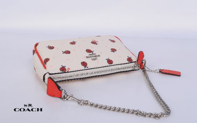 กระเป๋า-coach-handle-pouch-signature-ladybug-print