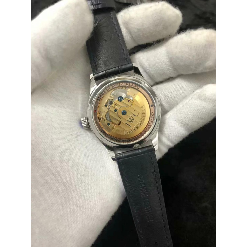 iwc-iwc-นาฬิกากลไกอัตโนมัติผู้ชายนาฬิกานาฬิกาข้อมือมู่เล่เดียวกลวงใบหน้าสีฟ้า