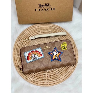COACH X PEANUTS LONG ZIP AROUND WALLET IN SIGNATURE CANVAS WITH VARSITY PATCHESS