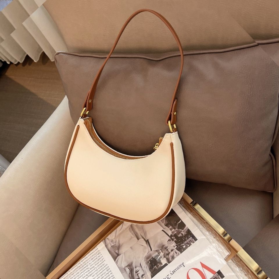 ภาพหน้าปกสินค้าพร้อมส่ง  Small C underarm bag female 2021 ใหม่แฟชั่น all-match ฝรั่งเศส niche high-end สไตล์ตะวันตกกระเป๋าสะพาย