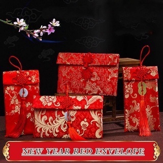 ภาพหน้าปกสินค้าซองจดหมายสีแดง ซองแดง ซองอั่งเปา 2022 红包 ผ้าศิลปะผ้าAngpao ปีใหม่จีนซองจดหมายสีแดงแพ็คเก็ตสีแดงแพ็คเก็ตเงินเทศกาลฤดูใบไม้ผลิที่มีปมจีนอ่างPow Hong ที่เกี่ยวข้อง