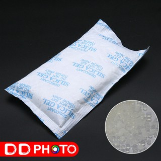 ภาพขนาดย่อของภาพหน้าปกสินค้าซองกันชื้น สารดูดความชื้น ซิลิก้าเจล Silica gel 100 กรัม , 200 กรัม จากร้าน dd_photo บน Shopee