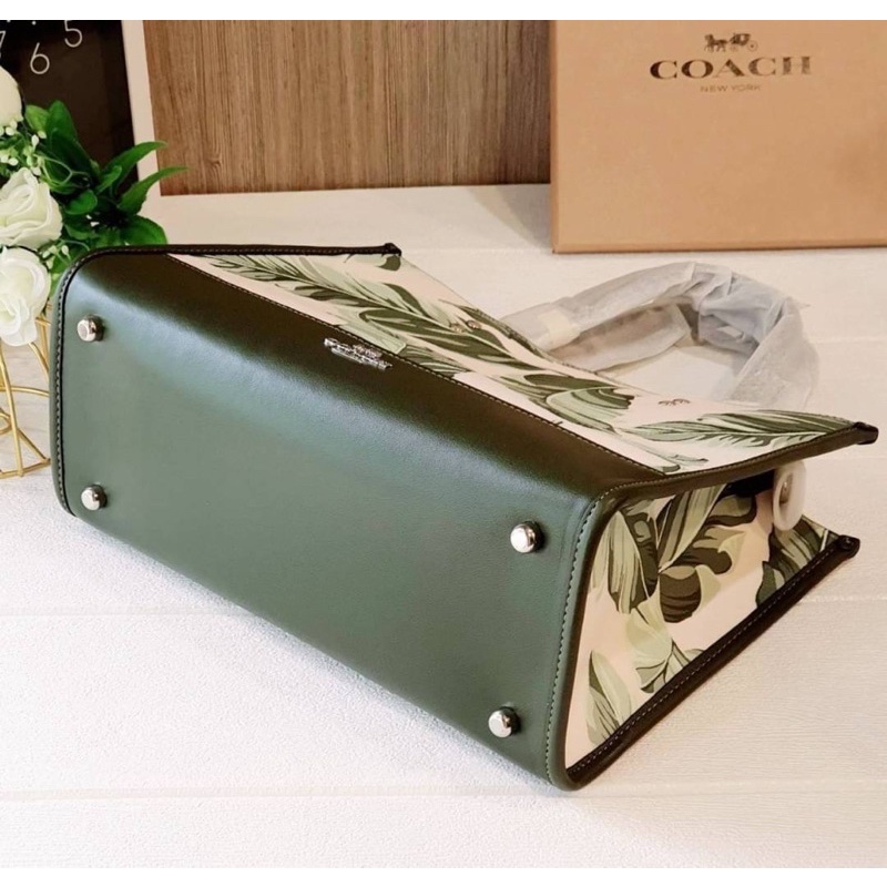 Coach dempsey carryall with banana leaves print hotsell