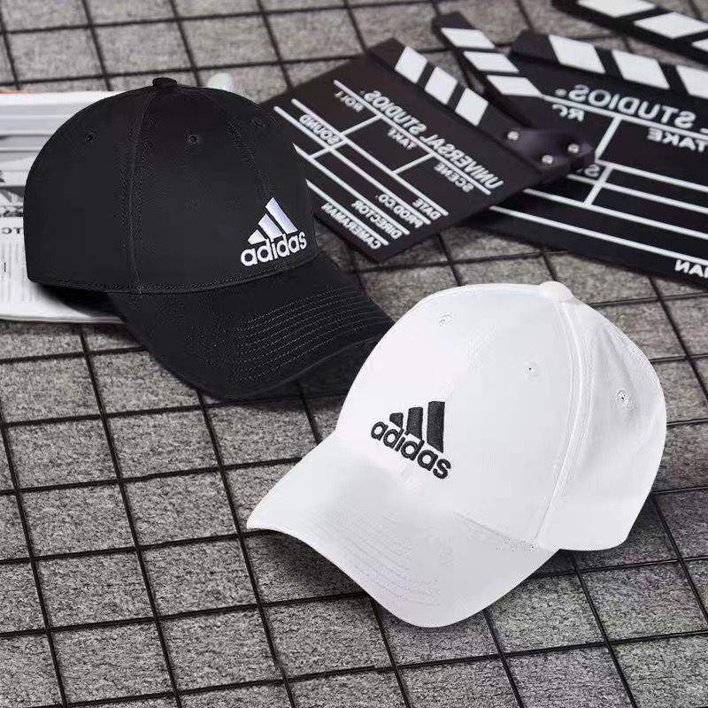 ภาพหน้าปกสินค้าอาดิดาส หมวกแฟชั่น หมวกผ้าฝ้าย สีทึบหมวกเบสบอลหมวกกลางแจ้งหมวกบังแดด Adidas Unisex Hat
