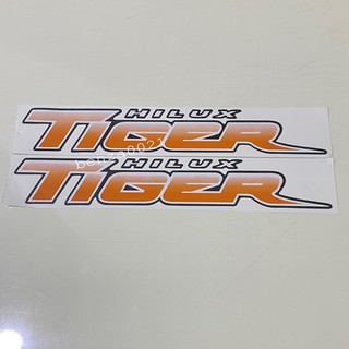 สติ๊กเกอร์* TIGER สีส้ม ปี 2003 ติดข้างท้ายกระบะ Toyota Hilux ( ราคาต่อคู่ มี 2 ชิ้น )