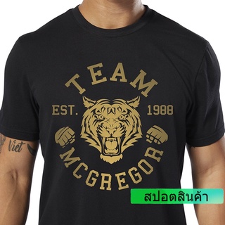 REEBOK เสื้อยืดแขนสั้น ลาย Conor McGregor golden tiger MMA สําหรับเล่นกีฬามวย