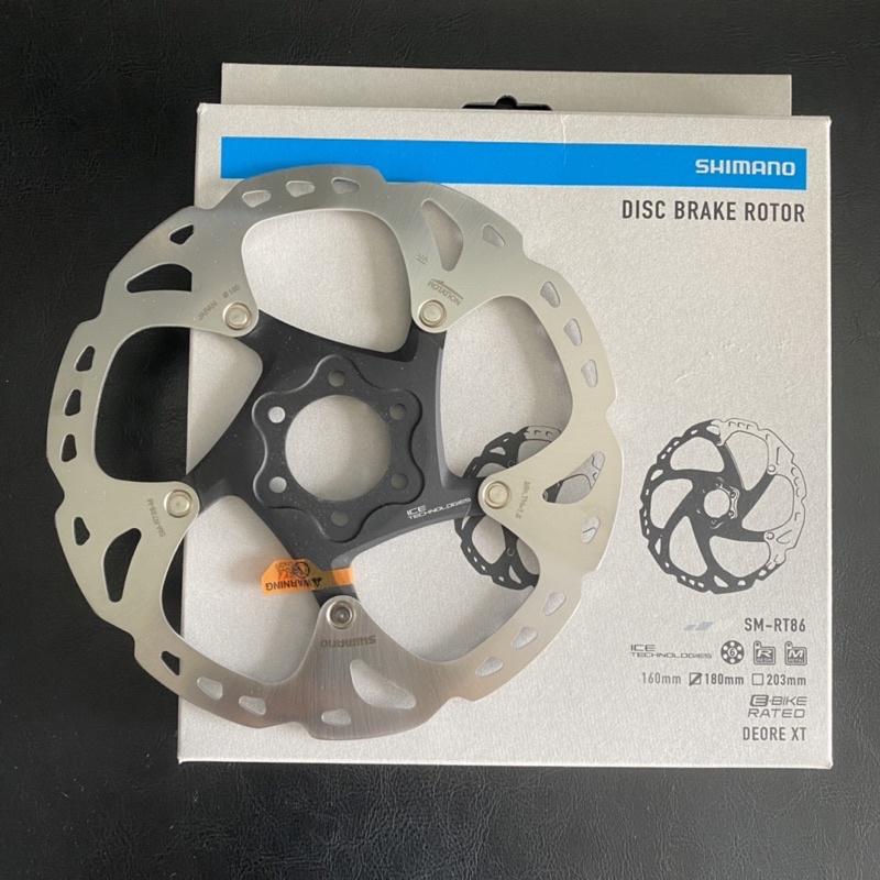 Disque De Frein Shimano SM-RT86 Deore XT - 180mm, 6 Trous, Ice-Tech, Argent/noir (neuf)