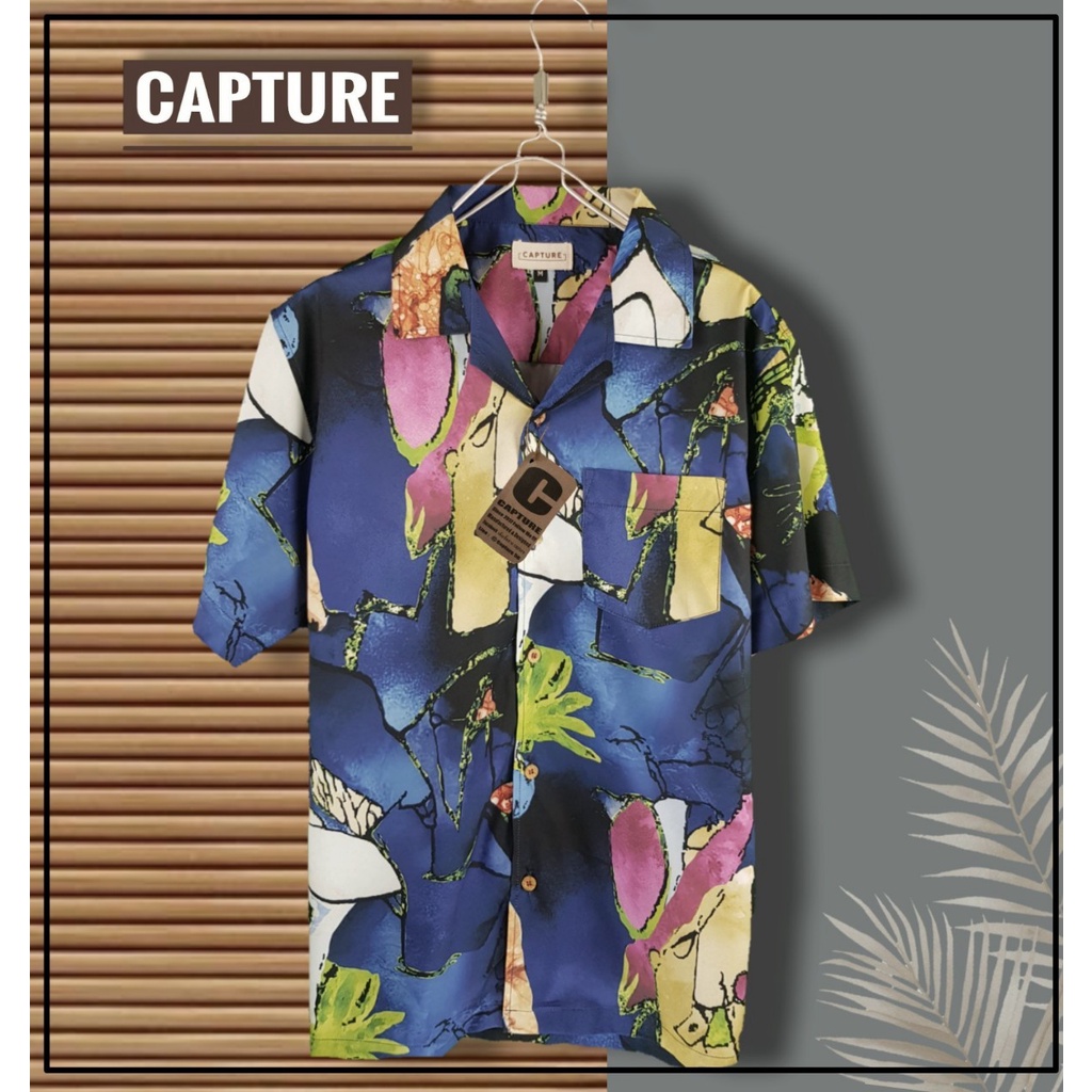 ภาพหน้าปกสินค้าHawaii Shirt เสื้อฮาวาย ผ้าไหมอิตาลี ลายกราฟฟิค สีกรม  มีถึงอก 48 นิ้ว จากร้าน katua_kt บน Shopee
