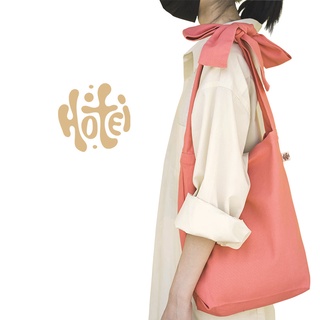 กระเป๋าผ้าผูกโบว์ สะพายข้าง แฟชั่นผู้หญิง สไตล์มินิมอล ทำจากผ้าแคนวาสอย่างดี แบรนด์ Hotei Bag
