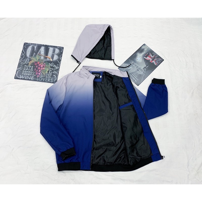 ภาพหน้าปกสินค้า(มี 3 ลาย) เสื้อแขนยาวผ้าร่ม สีทูโทน หมวกถอดได้ มีซับใน กระเป๋าลับ จากร้าน bm_oo1005 บน Shopee