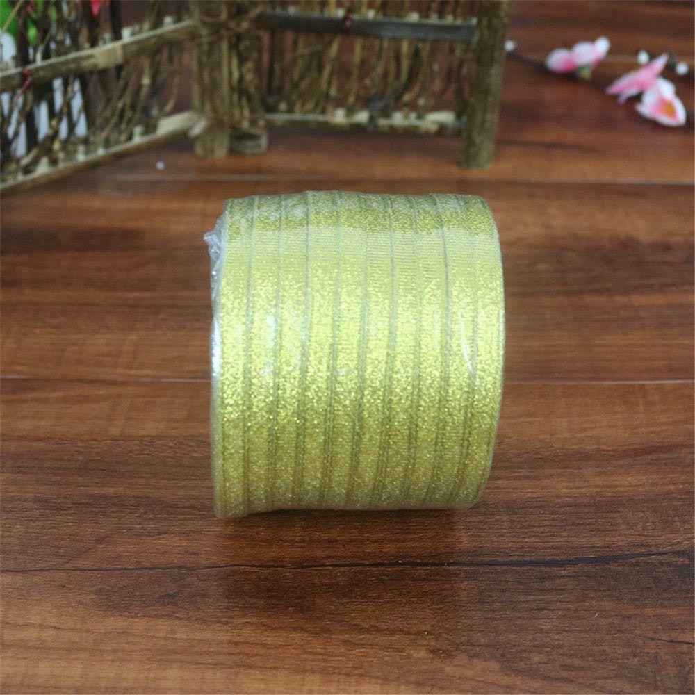 ริบบิ้นผ้าสีทอง-ริบบิ้นเนื้อทรายสีทอง-และสีเงิน-1ม้วน