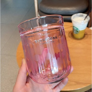 แก้วสีชมพูอมม่วงใส 2 ชั้น ด้านนอกเป็นผิวเรียบสกรีนลายดอกซากุระ