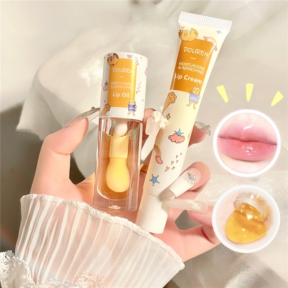 ภาพหน้าปกสินค้าDouren Natural Milk Honey Extract Lip Oil / ลิปครีมให้ความชุ่มชื้นยาวนาน / ซ่อมแซมริมฝีปากริ้วรอยบํารุงริมฝีปากเครื่องสําอาง จากร้าน trendycollection.th บน Shopee