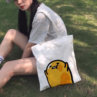 ภาพหน้าปกสินค้ากระเป๋าผ้าใบ สะพายไหล่ ลายไข่ gudetama lazy egg สีขาว 1 ชิ้น ที่เกี่ยวข้อง