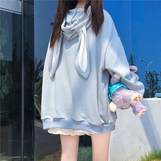 ภาพหน้าปกสินค้า🔥Hot sale~ เสื้อผ้าผู้หญิงฤดูใบไม้ผลิและฤดูใบไม้ร่วงของญี่ปุ่นปี 2020 ใหม่อินเทรนด์น่ารักหูกระต่ายมีฮู้ดตัวหลวมเสื้อกัน ที่เกี่ยวข้อง