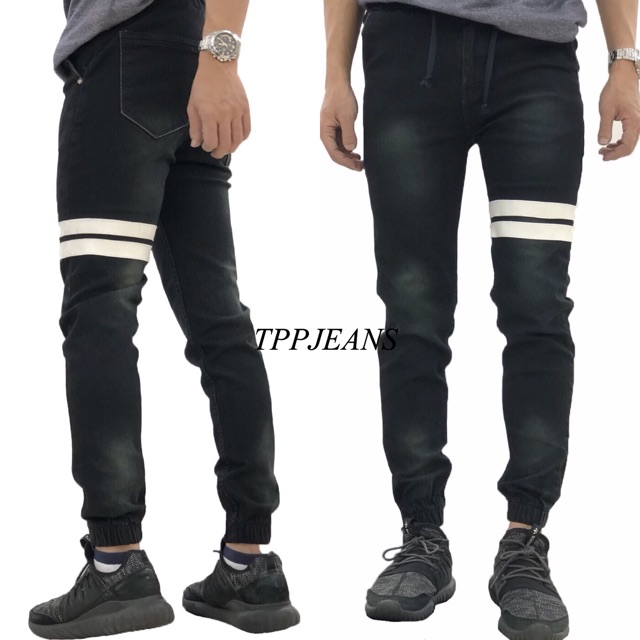 ภาพหน้าปกสินค้า(เอว28-44)JXP Jogger Jeans กางเกงขาจั้ม ผ้ายีนส์ยืด สีดำฟอก แต่งแถบขาว รับชำระปลายทาง