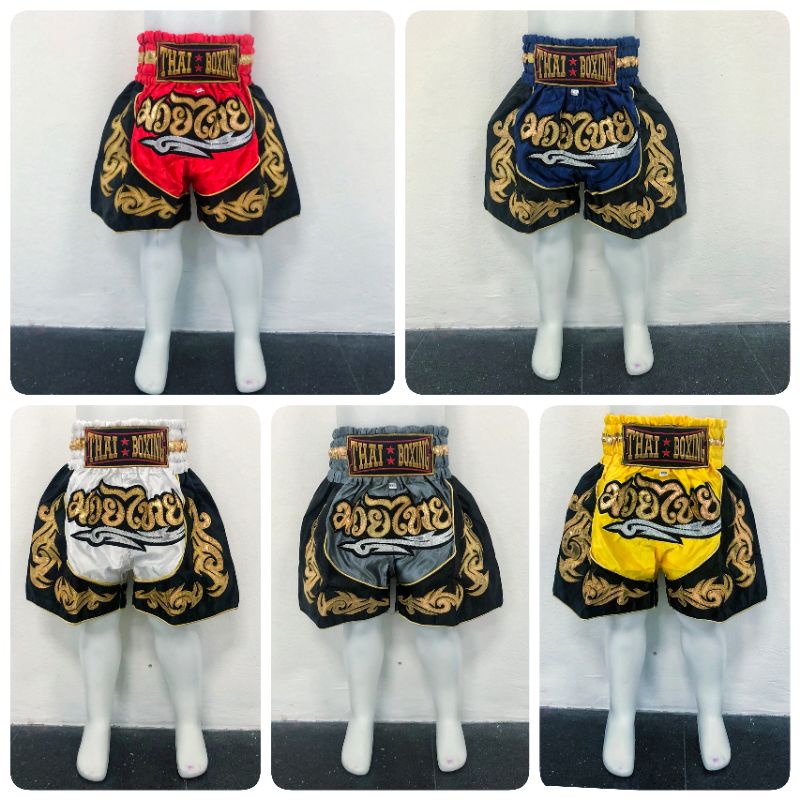 ภาพหน้าปกสินค้ากางเกงมวย กางเกงมวยไทย ของเด็ก ผ้าซาติน ปักอักษรสีทอง (Thai boxing) จากร้าน gale_june บน Shopee