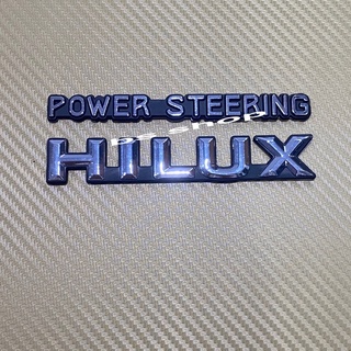 โลโก้ Hilux+POWER STEERING ติดแก้มข้าง สีเงินขอบดำ ราคาต่อชุด 2 ชิ้น