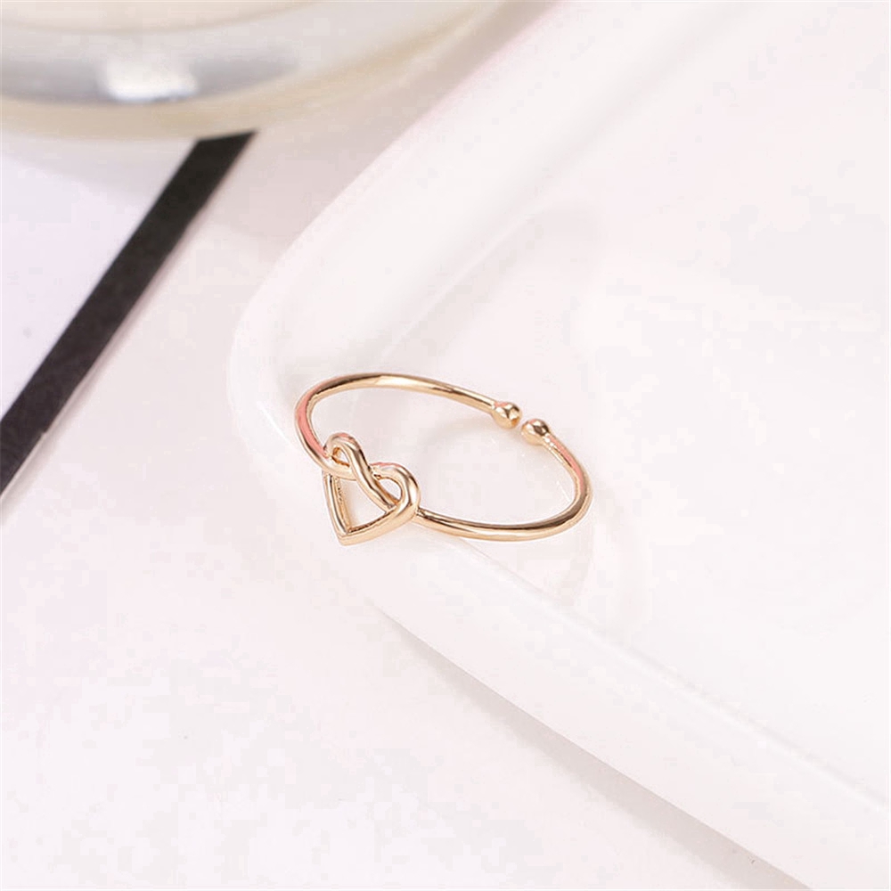 ภาพหน้าปกสินค้าCOD qipin แหวนสีทอง สีเงิน รูปหัวใจ สามารถปรับได้ จากร้าน qipin.th บน Shopee