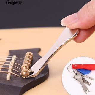 สินค้า Gregorio กีต้าร์สะพานขาพินอะคูสติกสตริง Ukulele Nail Peg Music Keychain Tool