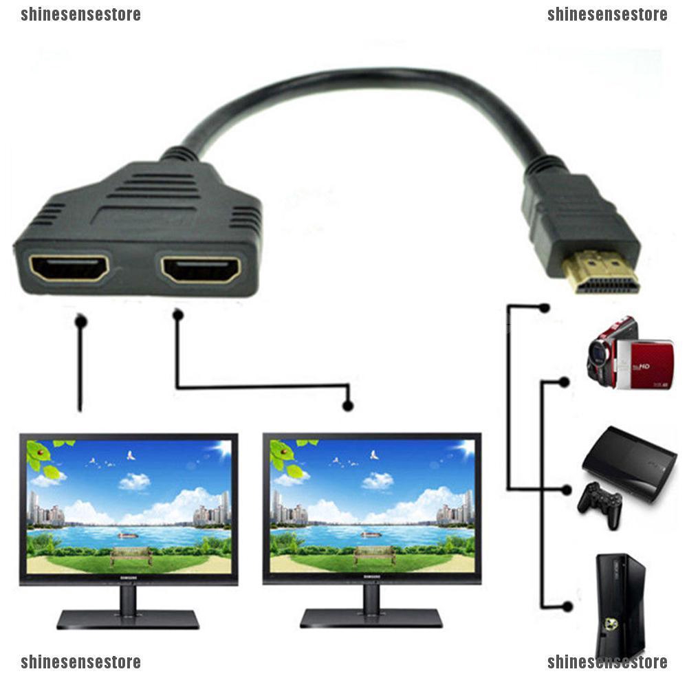 ภาพหน้าปกสินค้าอะแดปเตอร์แปลงสายเคเบิ้ล 1080P HDMI Port Male to 2Female 1 In 2 Out Splitter จากร้าน shinesensestore.th บน Shopee