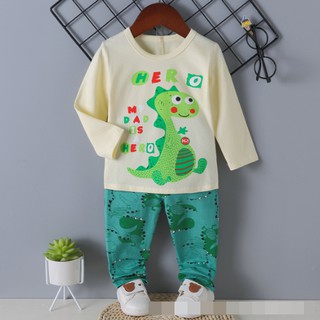 ชุดนอนเด็ก ลายไดโนเสาร์ เสื้อแขนยาวสีครีม พร้อมกางเกงสีเขียว