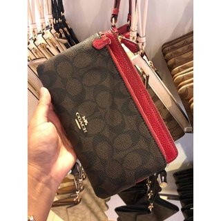 ภาพขนาดย่อของภาพหน้าปกสินค้าพร้อมส่ง แท้  % New Coach คล้องมือ 2 ซิป L DOUBLE ZIP WALLET IN SIGNATURE CANVAS (COACH C5576) IM/BROWN 1941 RED จากร้าน pinyada.d บน Shopee